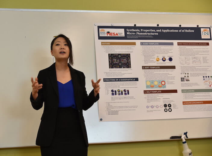 A colorful flyer is posted on a bulletin board that reads "STEM" in a college classroom.