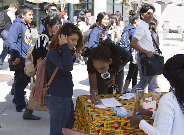 Club Day Young women sign up for a club at Mission College.