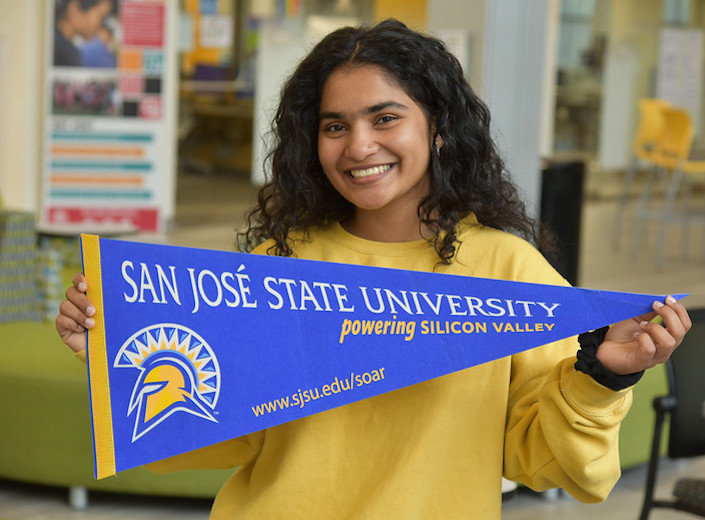 CSU pendant Student holds CSU pendant.